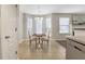 Cozy dining area featuring elegant table and chairs with natural light at 417 Red Coat Ln, Woodstock, GA 30188