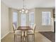 Bright dining area with a chandelier, and natural light at 417 Red Coat Ln, Woodstock, GA 30188