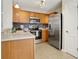 Well-lit kitchen featuring stainless steel appliances and tile flooring at 417 Red Coat Ln, Woodstock, GA 30188