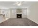 Spacious living room with a cozy fireplace, neutral colors, and ample natural light at 417 Red Coat Ln, Woodstock, GA 30188
