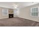 Bright and airy living room featuring a fireplace and large windows at 417 Red Coat Ln, Woodstock, GA 30188