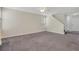 Spacious living room with carpet floors and lots of natural light at 417 Red Coat Ln, Woodstock, GA 30188