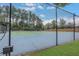 This property includes access to a well-maintained tennis court with a chain-link fence and a beautiful tree-lined backdrop at 417 Red Coat Ln, Woodstock, GA 30188