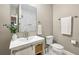 Bathroom with modern vanity, granite countertops, and a decorative mirror at 458 Holly Nw St, Atlanta, GA 30318