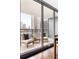 Inviting balcony showcasing cityscape views, outdoor seating, and access to the indoors at 620 Peachtree Ne St # 1206, Atlanta, GA 30308