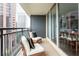 Cozy balcony with chairs, offers stunning views and is seamlessly connected to the dining area at 620 Peachtree Ne St # 1206, Atlanta, GA 30308