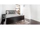 Modern bedroom with dark hardwood floors, neutral walls, city views and rug at 620 Peachtree Ne St # 1206, Atlanta, GA 30308