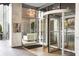 The building's entrance showcases a modern revolving door and a bright interior with a comfortable seating area at 620 Peachtree Ne St # 1206, Atlanta, GA 30308