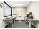 A well-equipped business center with computers, printers, and comfortable seating, ideal for remote work at 620 Peachtree Ne St # 1206, Atlanta, GA 30308