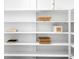 White shelving provides ample storage and organization in this well-lit closet at 620 Peachtree Ne St # 1206, Atlanta, GA 30308
