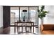Bright dining area with city views, stylish table setting, and comfortable seating at 620 Peachtree Ne St # 1206, Atlanta, GA 30308