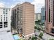 High-rise building with balconies and a street view featuring a refreshing outdoor pool at 620 Peachtree Ne St # 1206, Atlanta, GA 30308