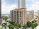 A high-rise building with multiple levels of residences and balconies, complemented by views of the cityscape at 620 Peachtree Ne St # 1206, Atlanta, GA 30308