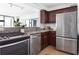 Modern kitchen features stainless appliances, granite counters and ample natural light through a large window at 620 Peachtree Ne St # 1206, Atlanta, GA 30308