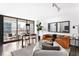 Spacious living area with city views, dining set and comfortable seating arrangement at 620 Peachtree Ne St # 1206, Atlanta, GA 30308