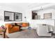 Comfortable living room with stylish seating, modern decor, and a view of the kitchen at 620 Peachtree Ne St # 1206, Atlanta, GA 30308