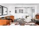 Open-concept living area with contemporary furniture, natural light, and an open kitchen at 620 Peachtree Ne St # 1206, Atlanta, GA 30308