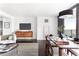 Open-concept living and dining area with stylish furniture and city views at 620 Peachtree Ne St # 1206, Atlanta, GA 30308