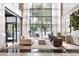 A modern lobby with high ceilings, designer lighting, and comfortable seating, creating an inviting atmosphere at 620 Peachtree Ne St # 1206, Atlanta, GA 30308