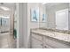 Bathroom with white cabinets, granite counters, and mermaid art at 2385 Saddle Brook Trce, Cumming, GA 30040