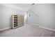 Neutral bedroom with carpet and built-in gray-toned dresser with small round window at 2385 Saddle Brook Trce, Cumming, GA 30040