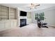 Bonus room with fireplace, built-in shelving, and fitness equipment at 2385 Saddle Brook Trce, Cumming, GA 30040