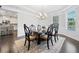 Formal dining room with a large wood table, chandelier, and bright windows at 2385 Saddle Brook Trce, Cumming, GA 30040