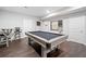 Game room with pool table and bar seating at 2385 Saddle Brook Trce, Cumming, GA 30040