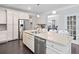 Gourmet kitchen with stainless appliances, granite countertops, and a breakfast bar island at 2385 Saddle Brook Trce, Cumming, GA 30040