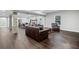 Open living room with exposed beams and hardwood floors at 2385 Saddle Brook Trce, Cumming, GA 30040