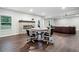 Open living room with fireplace, hardwood floors, and unique furnishings at 2385 Saddle Brook Trce, Cumming, GA 30040