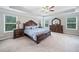 Spacious main bedroom featuring a tray ceiling and large windows at 2385 Saddle Brook Trce, Cumming, GA 30040