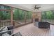 Relaxing screened porch featuring comfortable seating and wooded views at 2385 Saddle Brook Trce, Cumming, GA 30040