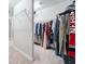Walk-in closet with custom shelving and clothing racks at 2385 Saddle Brook Trce, Cumming, GA 30040
