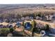 Aerial view displays the property nestled in a tree-lined neighborhood at 271 Double Gate Ct, Sugar Hill, GA 30518