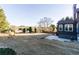 Large backyard with a lush lawn and mature trees at 271 Double Gate Ct, Sugar Hill, GA 30518