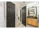 Full bathroom with granite counters, framed mirror, and tiled shower at 271 Double Gate Ct, Sugar Hill, GA 30518