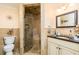 Bathroom featuring a glass-enclosed shower and granite-topped vanity at 271 Double Gate Ct, Sugar Hill, GA 30518