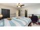 Bedroom with ceiling fan, ample space, and door leading to hall at 271 Double Gate Ct, Sugar Hill, GA 30518