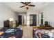 Spacious bedroom with ceiling fan, two beds, and ample closet space at 271 Double Gate Ct, Sugar Hill, GA 30518