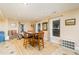 Well-lit dining area with a wooden table and chairs, providing a cozy and inviting space for meals at 271 Double Gate Ct, Sugar Hill, GA 30518