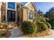 Elegant home featuring a front entrance with double doors and decorative plants at 271 Double Gate Ct, Sugar Hill, GA 30518