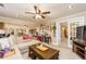 Comfortable living room with a large sofa, coffee table, and plenty of natural light at 271 Double Gate Ct, Sugar Hill, GA 30518