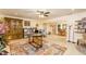 Open living room with a large rug, desk and dining areas, providing ample space for various activities at 271 Double Gate Ct, Sugar Hill, GA 30518