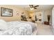 Bedroom with floral bedding, a vanity, and french doors at 271 Double Gate Ct, Sugar Hill, GA 30518