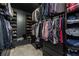 Organized walk-in closet with shelving and hanging racks for clothes and shoes at 271 Double Gate Ct, Sugar Hill, GA 30518