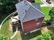 Aerial view of home with brick facade, backyard with patio and lush green lawn at 2725 Bailey Ne Pl, Conyers, GA 30013