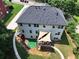 Aerial view of backyard with patio, lawn and landscaping featuring multi-pane windows at 2725 Bailey Ne Pl, Conyers, GA 30013