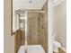 Modern bathroom with glass enclosed shower and toilet in neutral tones at 2725 Bailey Ne Pl, Conyers, GA 30013