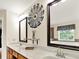 Bright bathroom with double vanity, granite countertops, and decorative accents at 2725 Bailey Ne Pl, Conyers, GA 30013